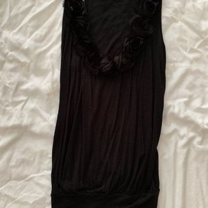 Black sleeveless blouse with flowers around neck